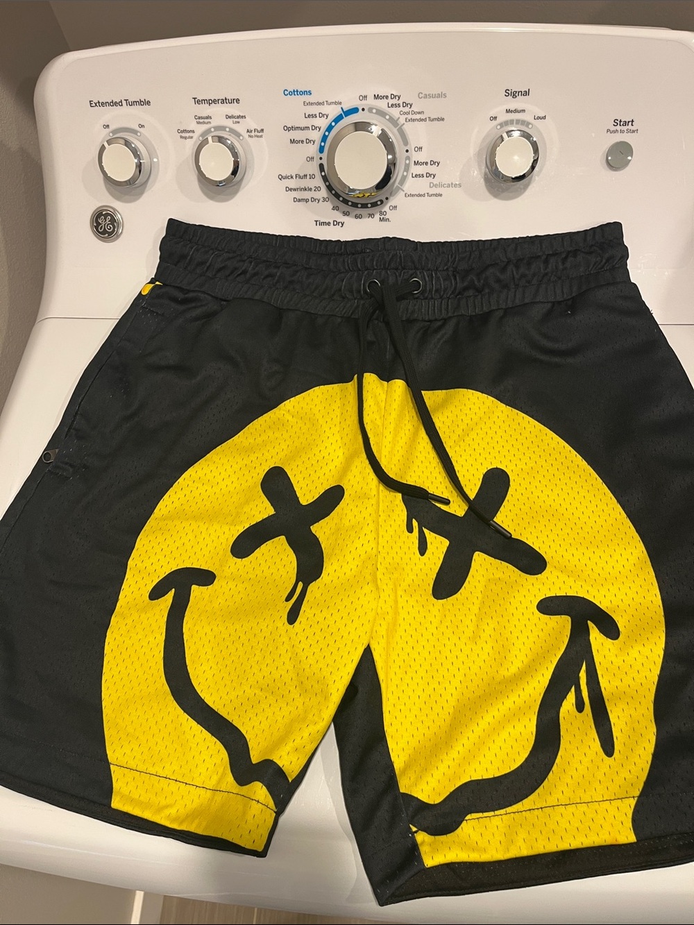 Men's Black Athletic Mesh Shorts with Yellow Drip Smiley Graphic